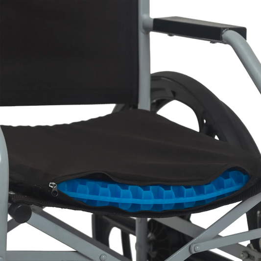 Almofada de assento ergonômica em gel de silicone com estrutura em favo de mel, projetada para absorção de impacto, distribuição de peso e alívio de pressão no cóccix, combina camada de gel térmico com estrutura de memória macia e capa respirável e lavável para uso diário.