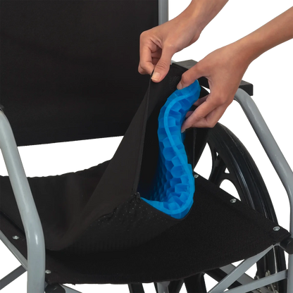 Almofada de assento ergonômica em gel de silicone com estrutura em favo de mel, projetada para absorção de impacto, distribuição de peso e alívio de pressão no cóccix, combina camada de gel térmico com estrutura de memória macia e capa respirável e lavável para uso diário.