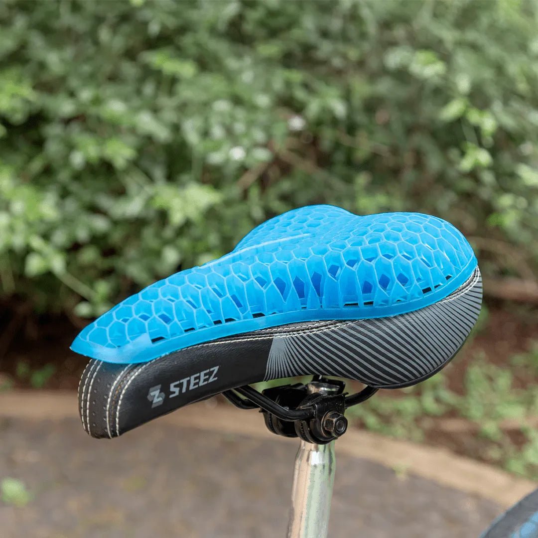 Almofada de assento ergonômica em gel de silicone com estrutura em favo de mel, projetada para absorção de impacto, distribuição de peso e alívio de pressão no cóccix, dispositivo de conforto ergonômico que proporciona dissipação de calor, suporte firme e extrema maciez.